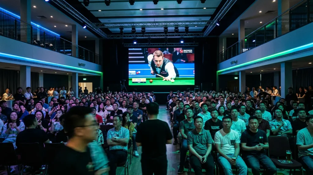 Packed audience watching a professional snooker match broadcast on a large screen in a Chinese sports venue