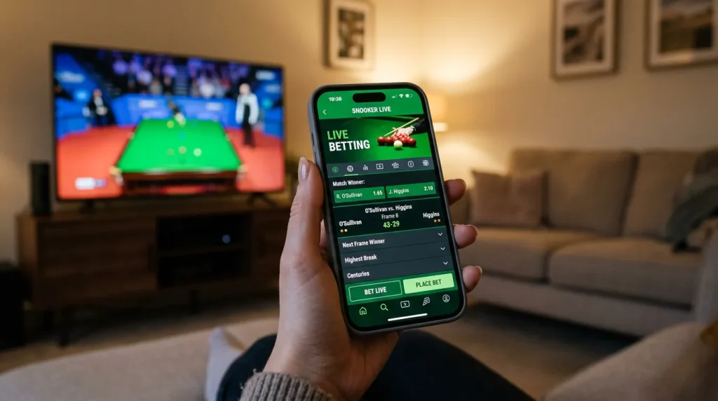 Smartphone held in hand showing a live snooker match with betting odds on screen