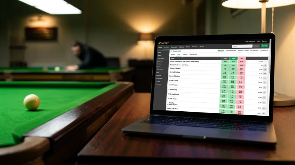 Laptop screen displaying back and lay exchange odds for a live snooker match beside a green baize table